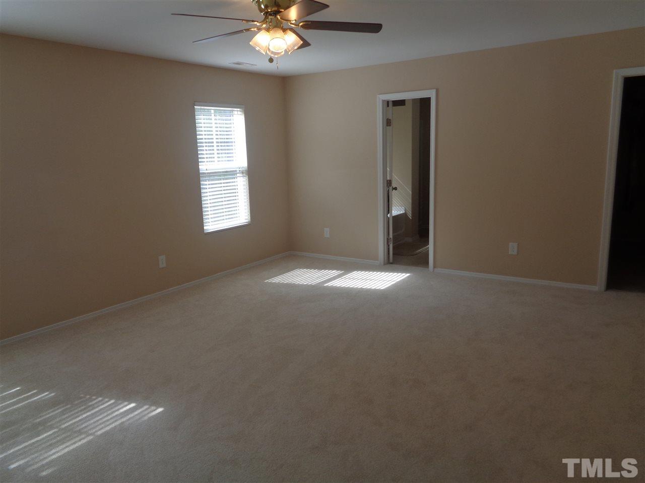 3033 Varcroft Road Knightdale, NC 27545 - Photo 8 of 16 a view of an empty room with a window