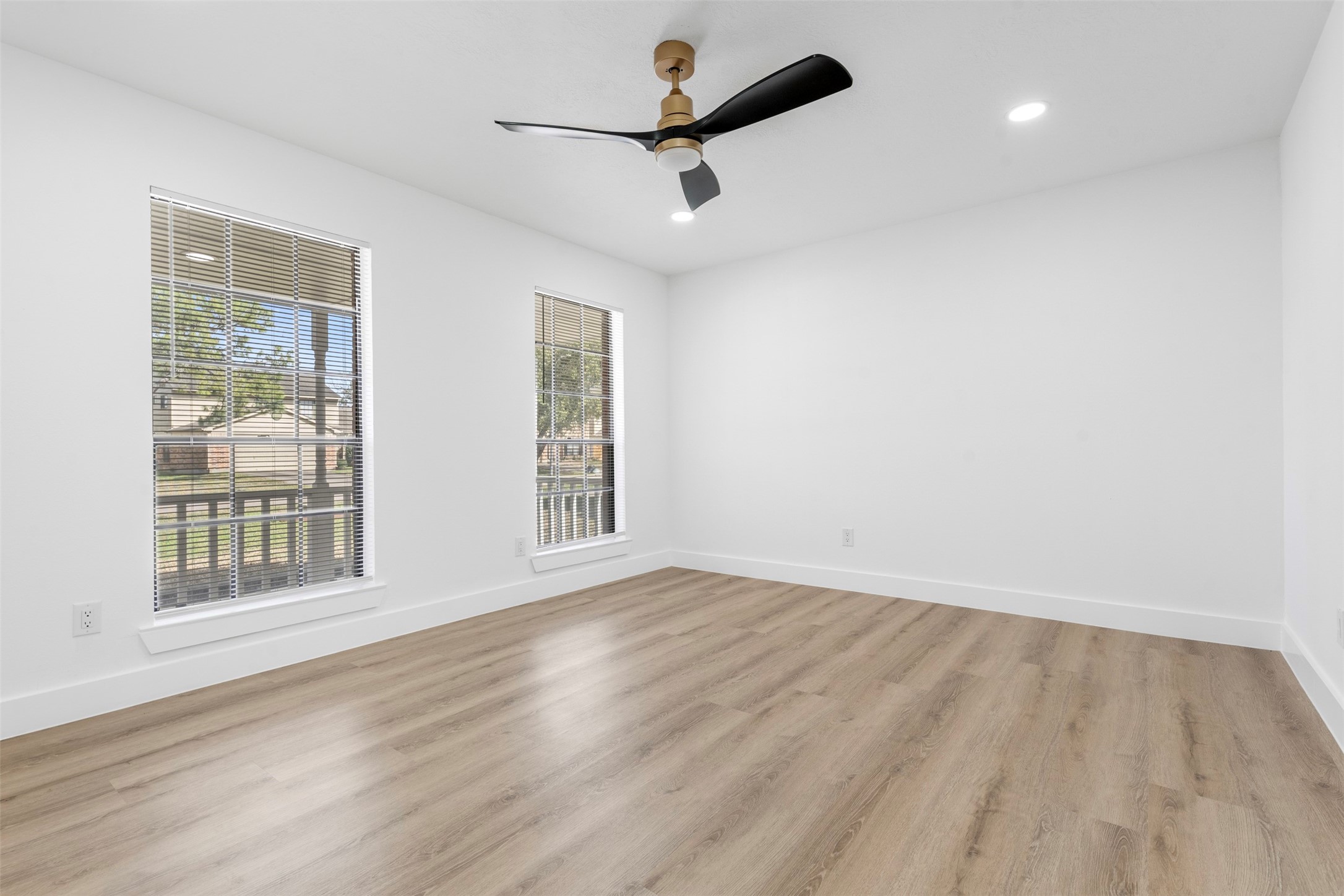 14922 Waybridge Drive Houston, TX 77062 - Photo 13 of 49 a view of an empty room with a window and wooden floor