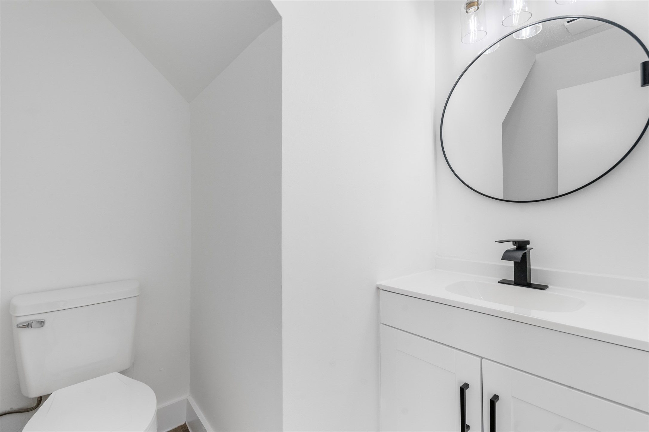 14922 Waybridge Drive Houston, TX 77062 - Photo 24 of 49 a bathroom with a toilet sink and mirror