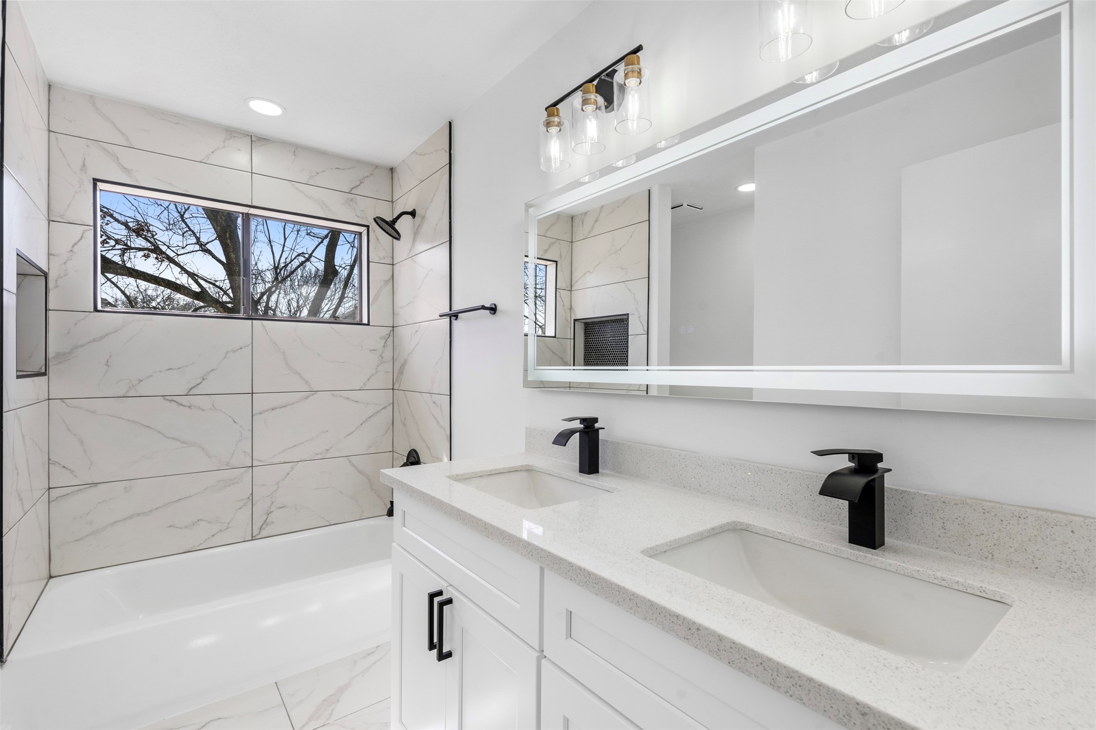 14922 Waybridge Drive Houston, TX 77062 - Photo 32 of 49 a bathroom with a bathtub and a sink