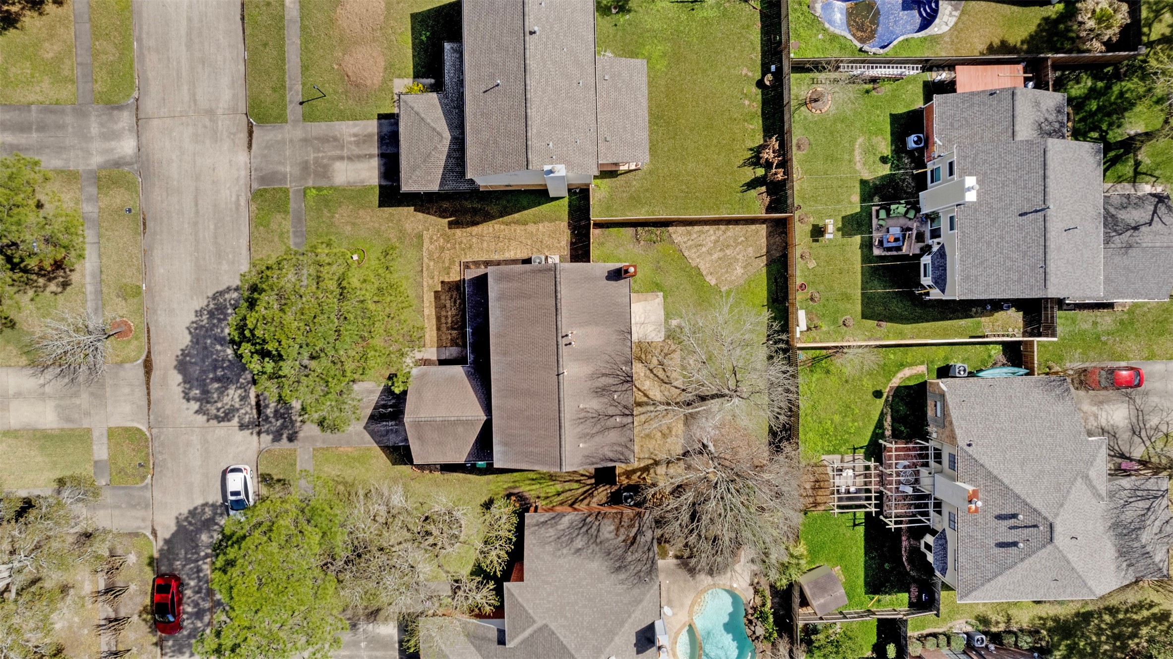 14922 Waybridge Drive Houston, TX 77062 - Photo 47 of 49 an aerial view of a house with a yard and trees