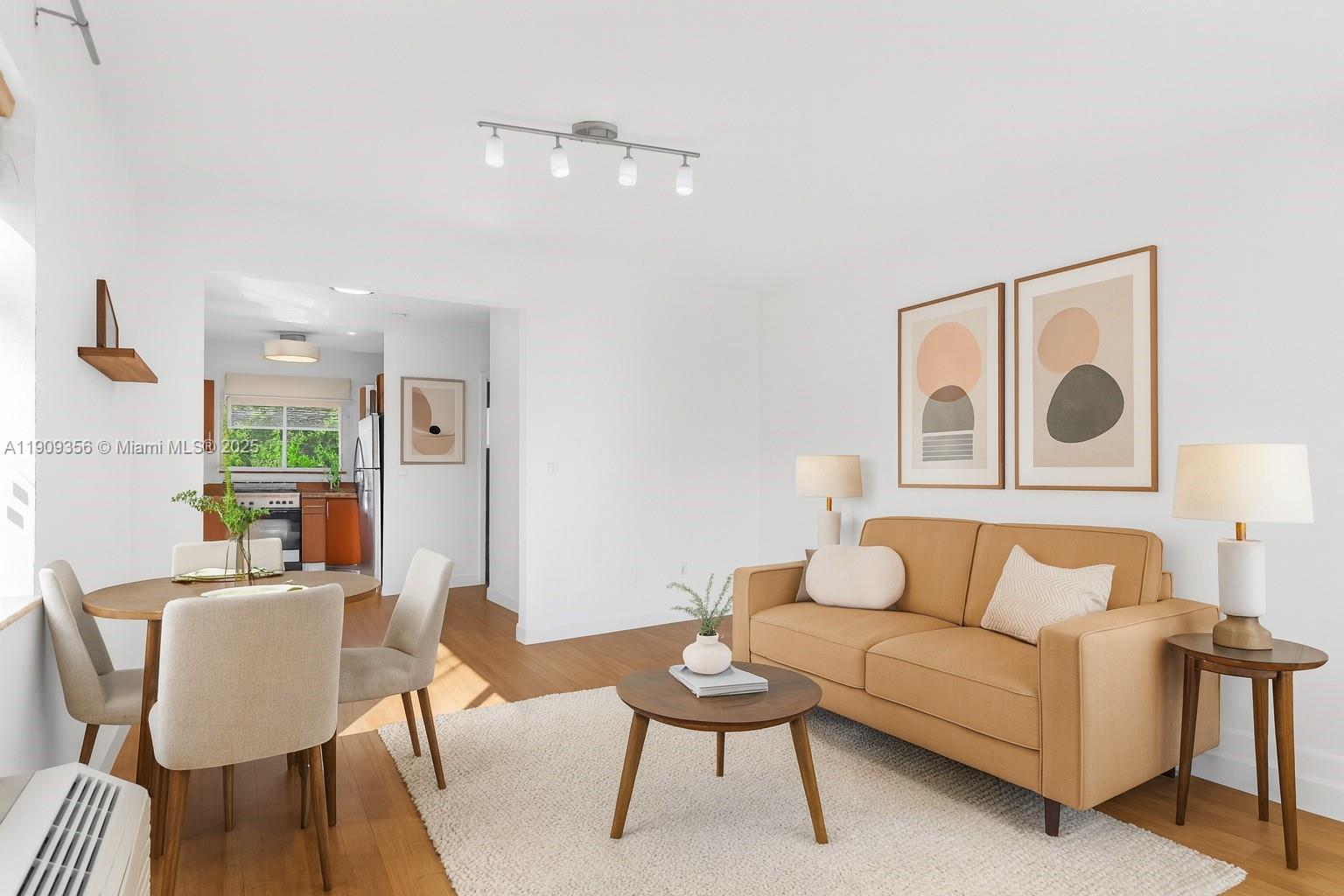 1010 Pennsylvania Avenue, Unit 14 Miami Beach, FL 33139 - Photo 7 of 8 a living room with furniture and a table