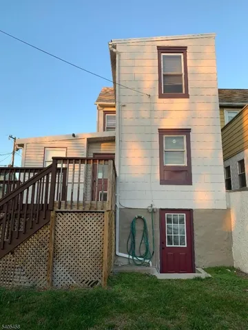 a view of a brick house with a yard