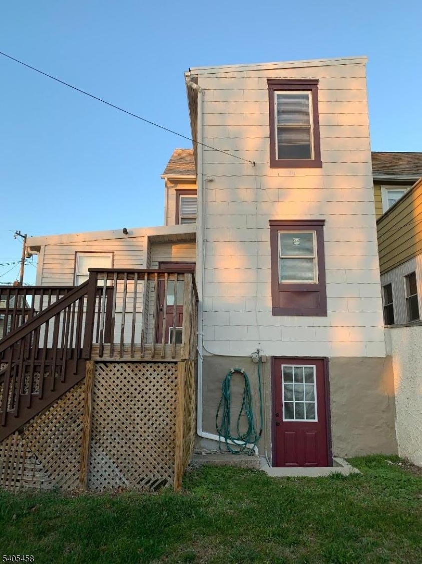 258 Chambers Street Phillipsburg, NJ 08865 - Photo 7 of 9 a view of a brick house with a yard