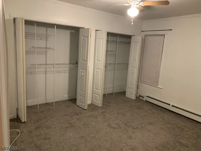 an empty room with closet area