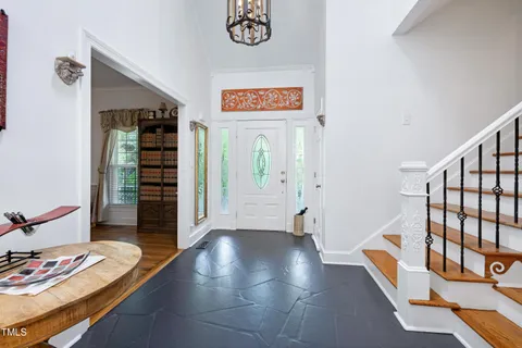 a view of an entryway with wooden floor