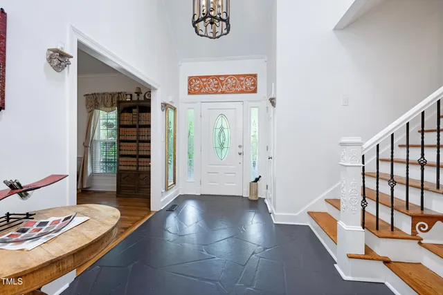 a view of an entryway with wooden floor