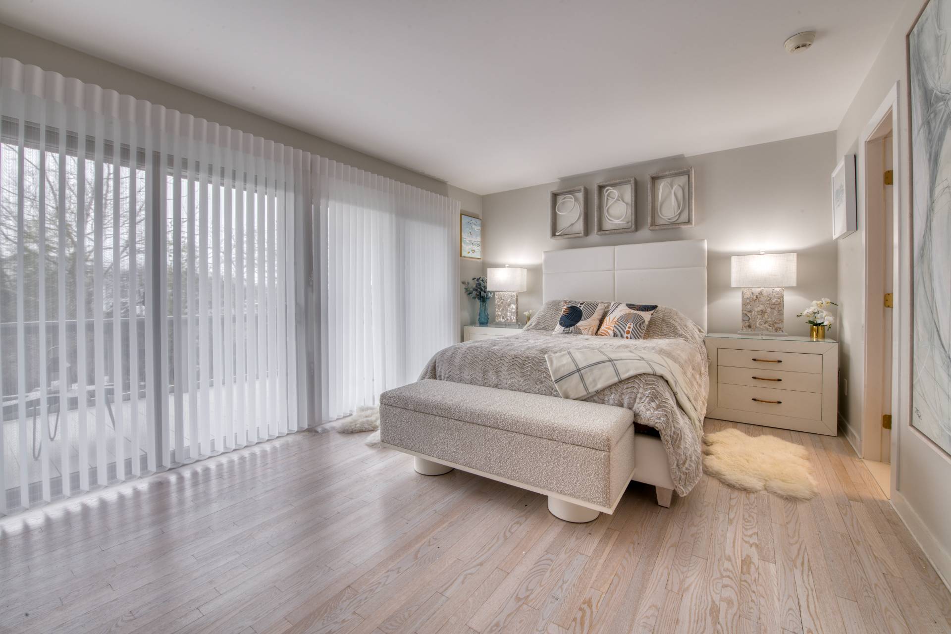 18 Bridge Street Sag Harbor, NY 11963 - Photo 12 of 17 a bedroom with a bed lamp and a large window