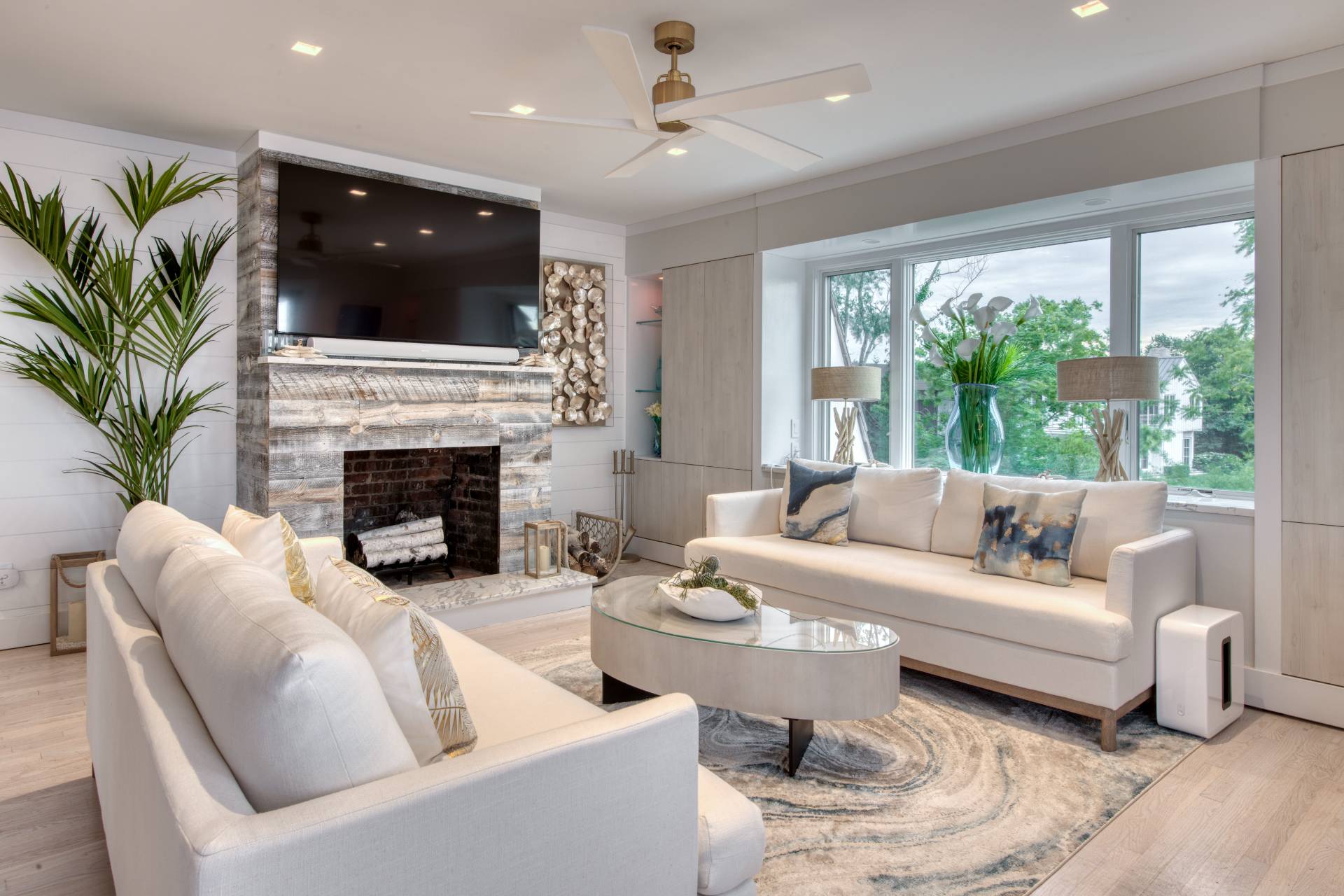 18 Bridge Street Sag Harbor, NY 11963 - Photo 6 of 17 a living room with furniture fireplace and a large window