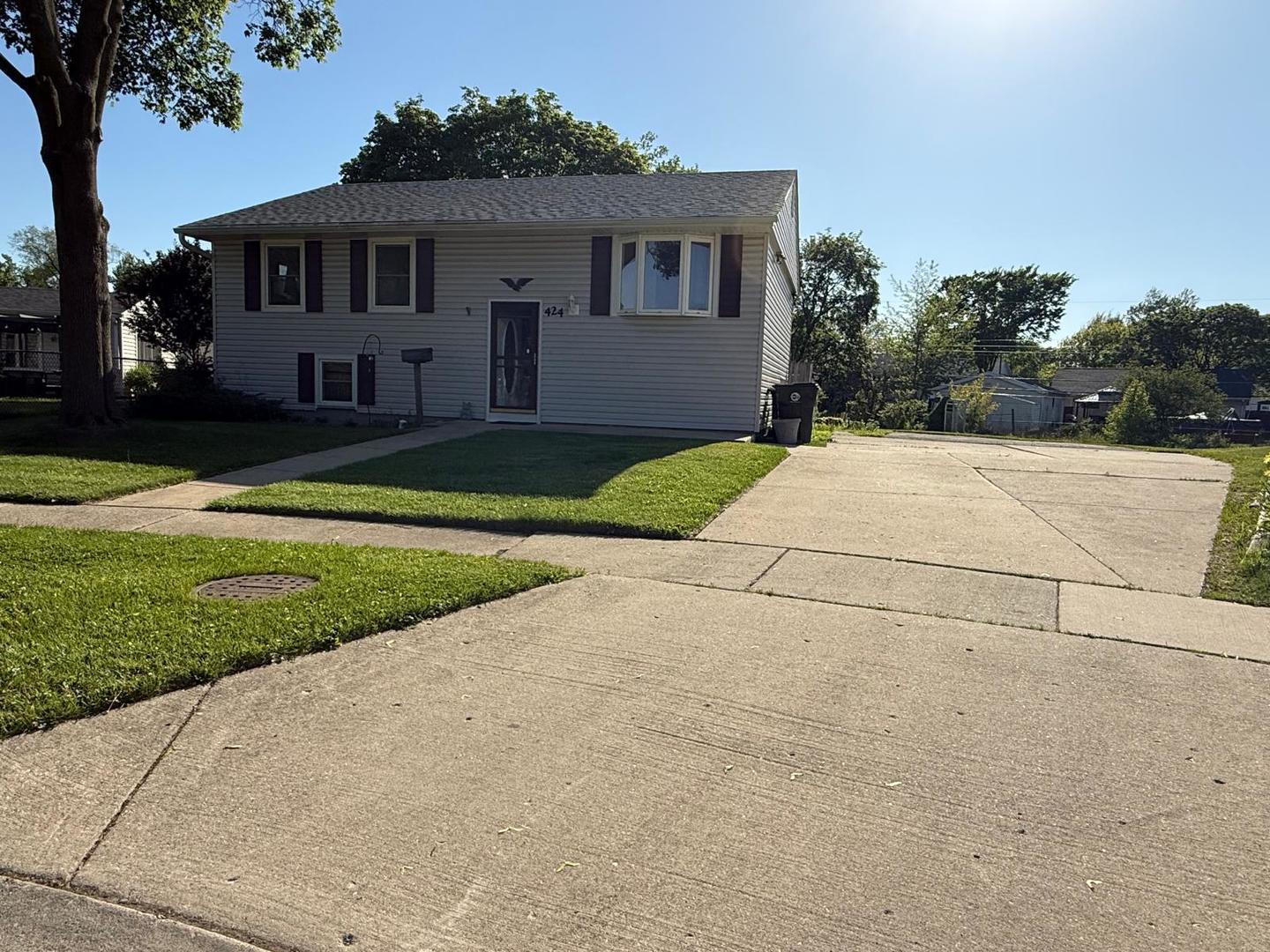 a front view of a house with yard
