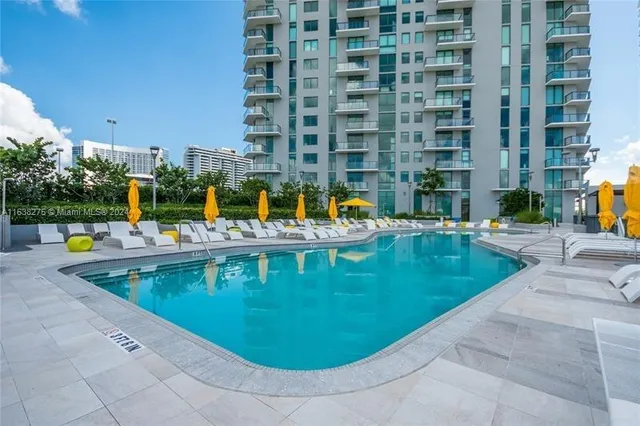 a view of a swimming pool with a patio