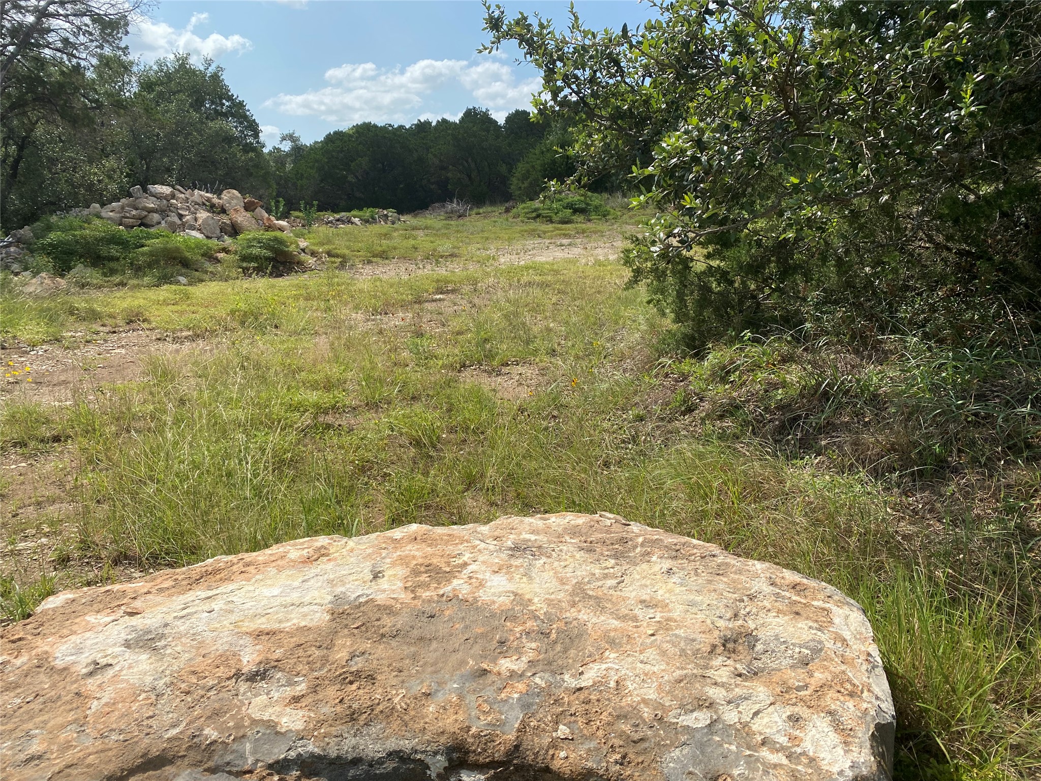 Tbd Tbd Fm 3237/whisper Ridge Wimberley, TX 78676 - Photo 6 of 10 open lot with good tree for privacy. Many stones in piles could stay with the property