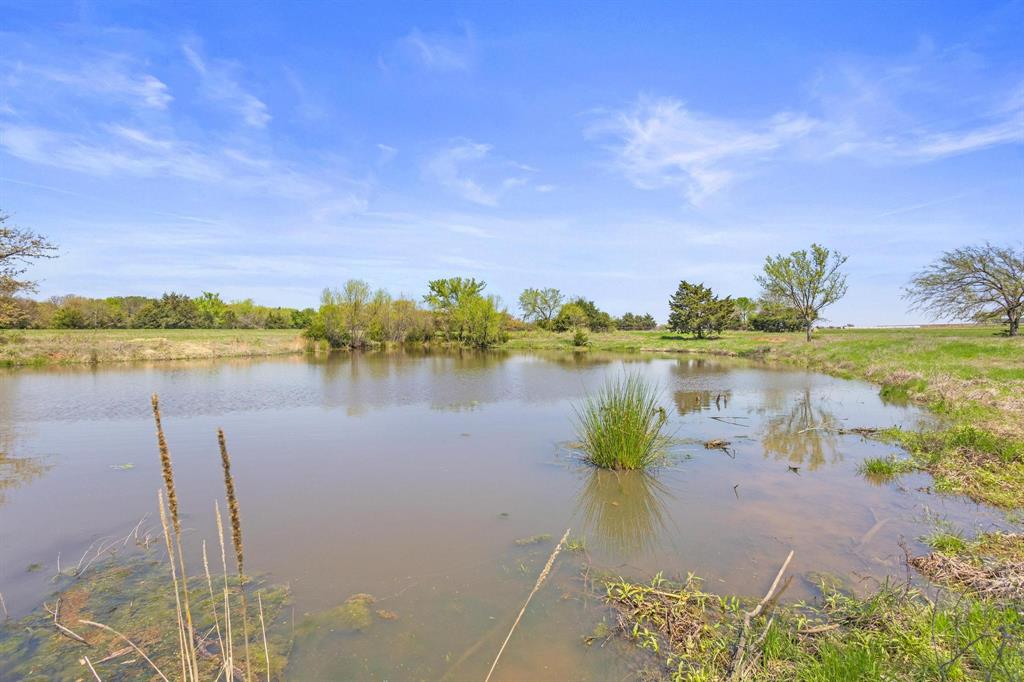 1 Hog Town Road Collinsville, TX 76233 - Photo 12 of 16 a view of a lake with outdoor space