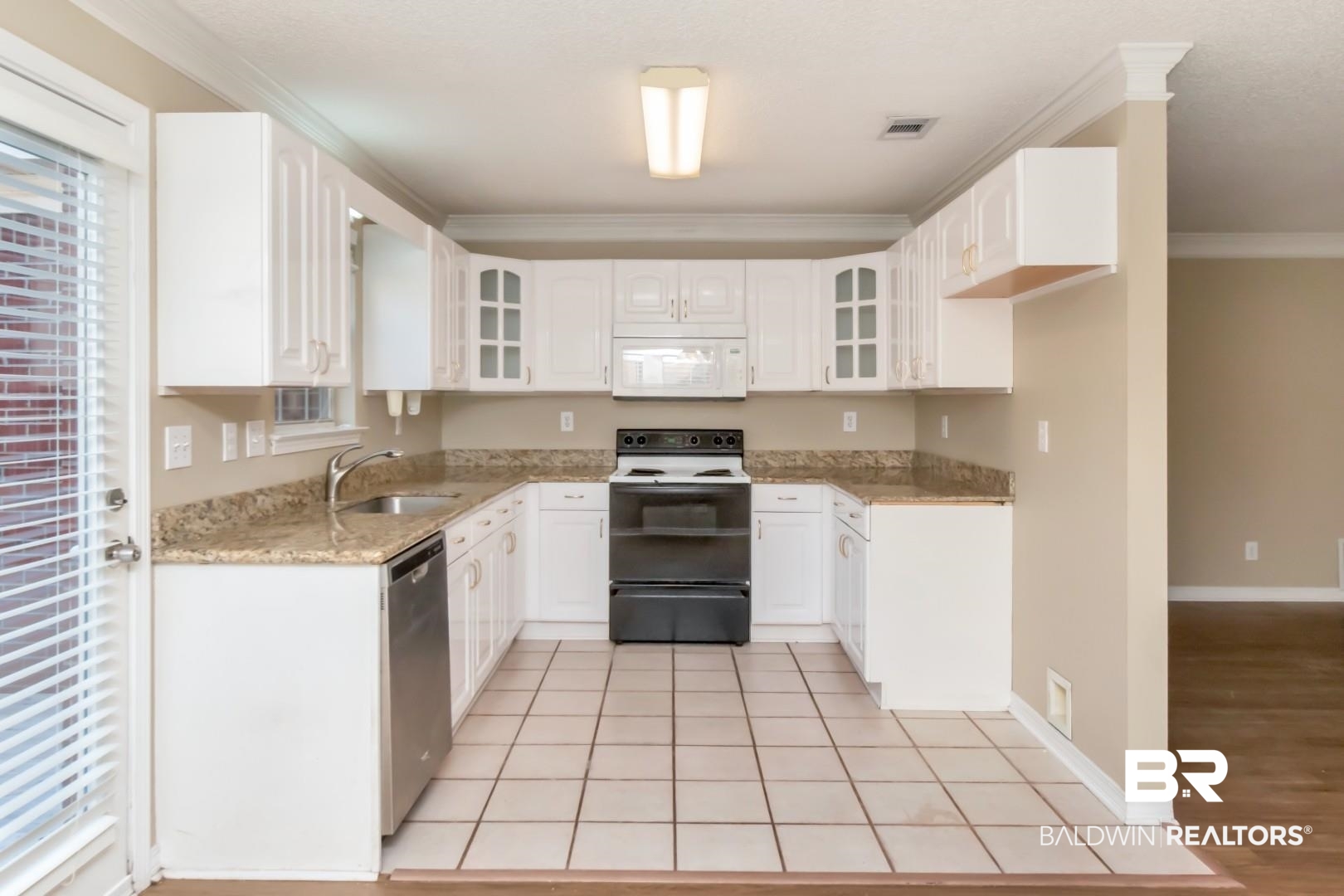 6482 Cedar Bend Court Mobile, AL 36608 - Photo 9 of 26 Kitchen with white appliances, light stone counters, glass insert cabinets, white cabinetry, and ornamental molding