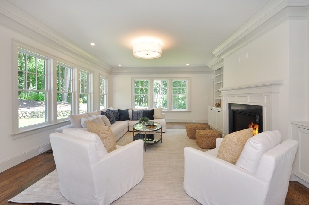 248 Nashawtuc Road Concord, MA 01742 - Photo 12 of 38 a living room with furniture and a fireplace