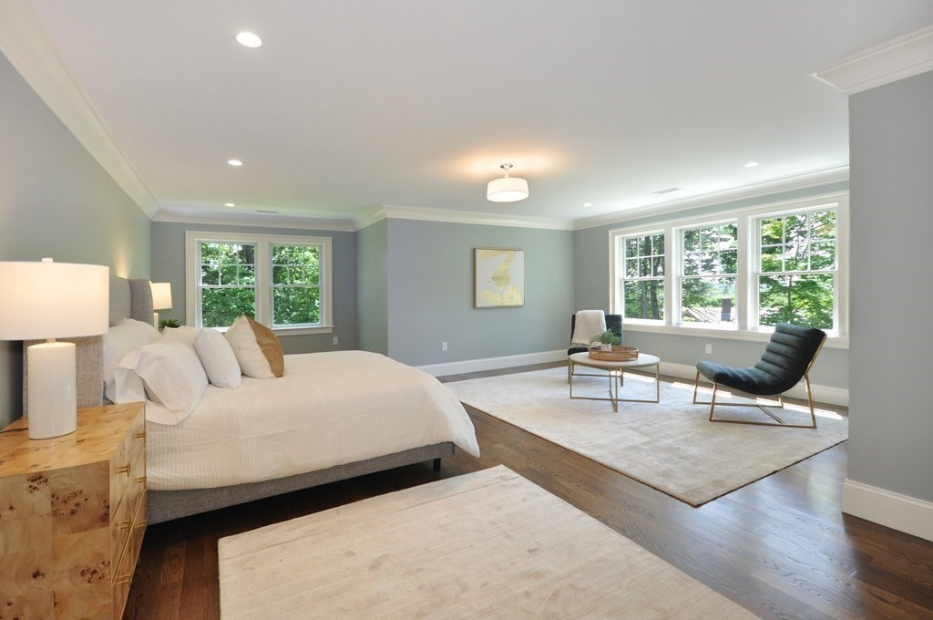 248 Nashawtuc Road Concord, MA 01742 - Photo 16 of 38 a bedroom with a bed and large windows