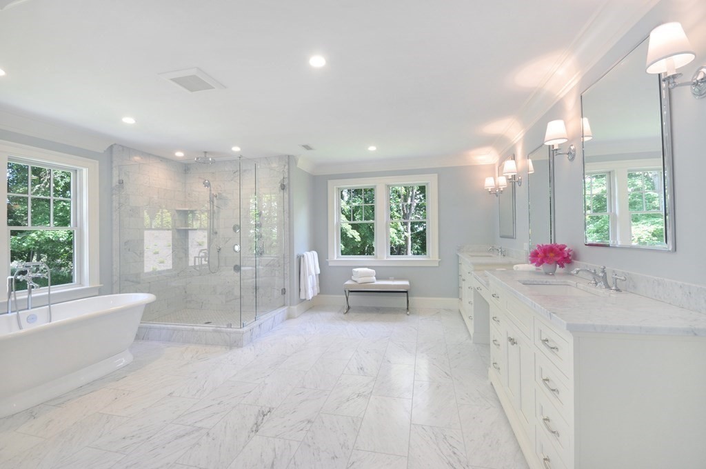 248 Nashawtuc Road Concord, MA 01742 - Photo 18 of 38 a bathroom with a bathtub sink and mirror