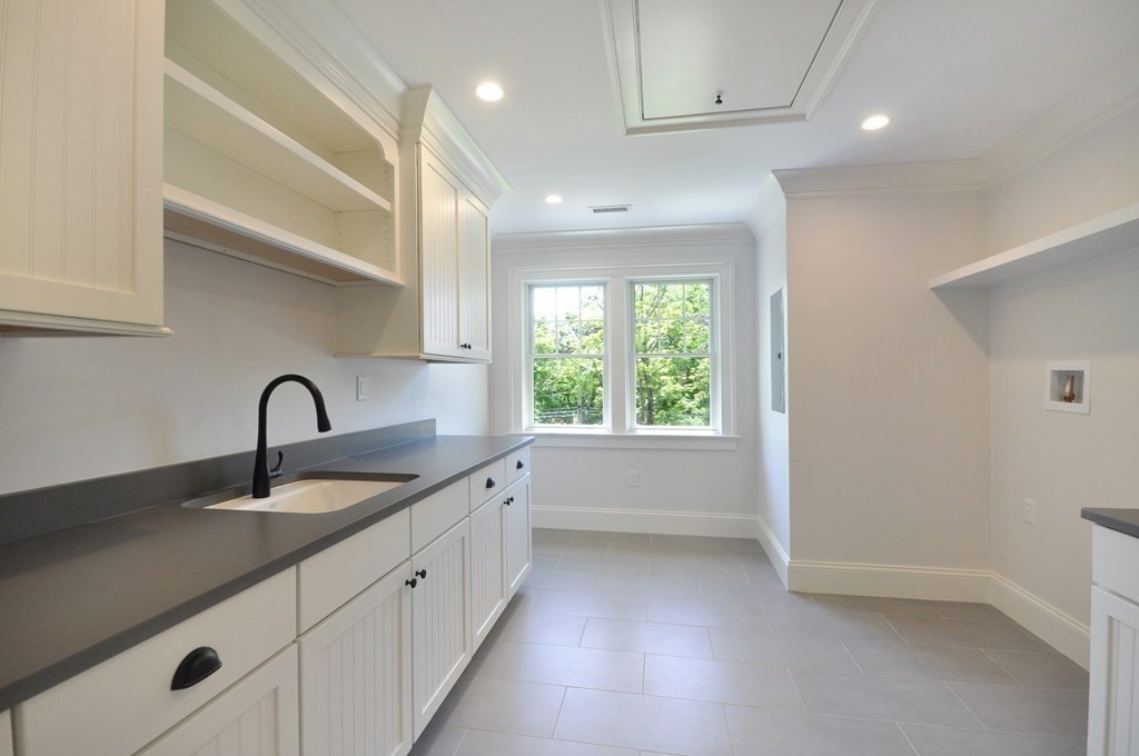 248 Nashawtuc Road Concord, MA 01742 - Photo 20 of 38 a kitchen with a sink and a window