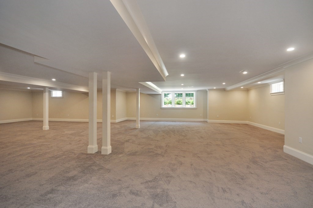 248 Nashawtuc Road Concord, MA 01742 - Photo 21 of 38 an empty room with windows and pillars in it