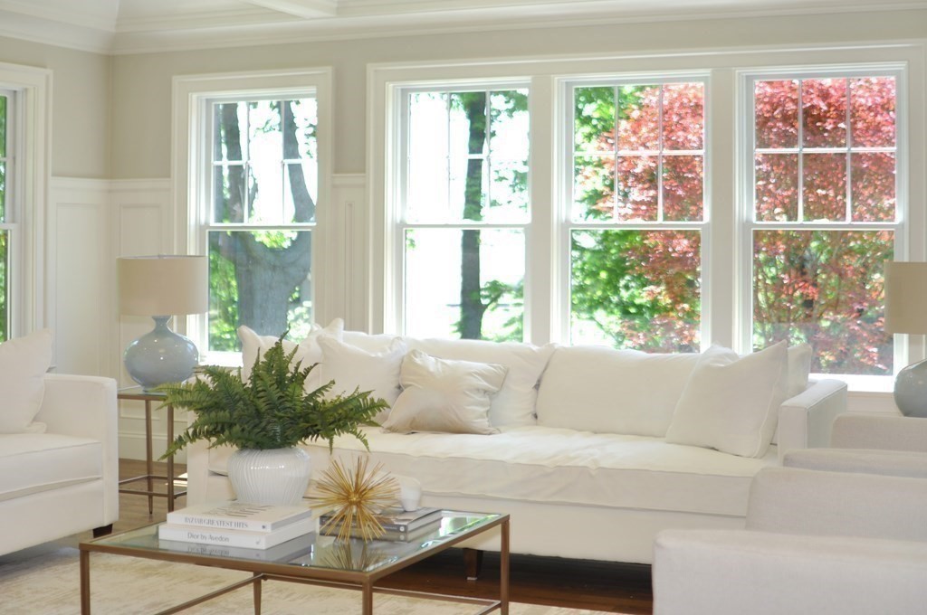 248 Nashawtuc Road Concord, MA 01742 - Photo 24 of 38 a living room with furniture and a potted plant