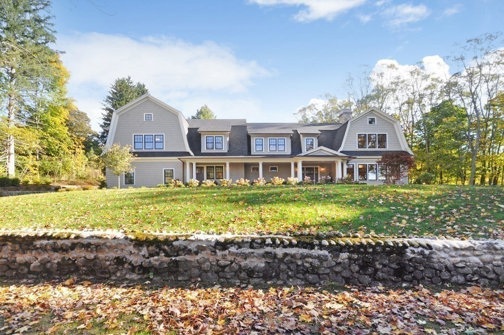248 Nashawtuc Road Concord, MA 01742 - Photo 27 of 38 a front view of a house with a yard