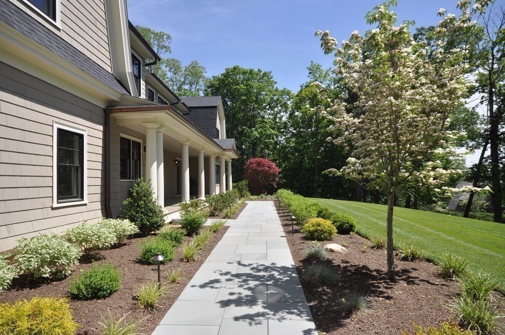 248 Nashawtuc Road Concord, MA 01742 - Photo 34 of 38 a view of a house with a garden
