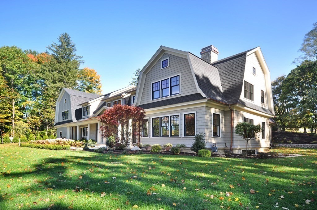 248 Nashawtuc Road Concord, MA 01742 - Photo 35 of 38 a front view of a house with a garden
