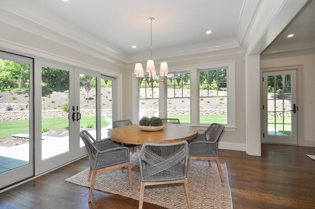 248 Nashawtuc Road Concord, MA 01742 - Photo 9 of 38 a dining room with furniture window and wooden floor