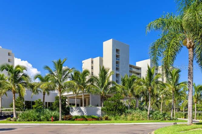 250 Sands Point Road, Unit 5203 Longboat Key, FL 34228 - Photo 16 of 32 a front view of a house with a yard