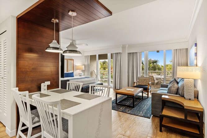 250 Sands Point Road, Unit 5203 Longboat Key, FL 34228 - Photo 3 of 32 a living room with furniture and a large window