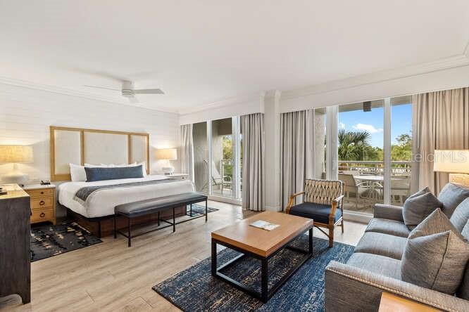 250 Sands Point Road, Unit 5203 Longboat Key, FL 34228 - Photo 4 of 32 a living room with furniture and a window