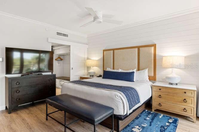 250 Sands Point Road, Unit 5203 Longboat Key, FL 34228 - Photo 7 of 32 a bedroom with a bed and a dresser