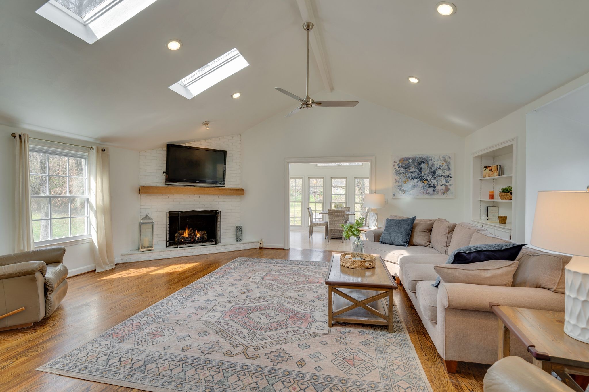745 Elysian Fields Road Nashville, TN 37204 - Photo 18 of 60 a living room with furniture a fireplace and a flat screen tv