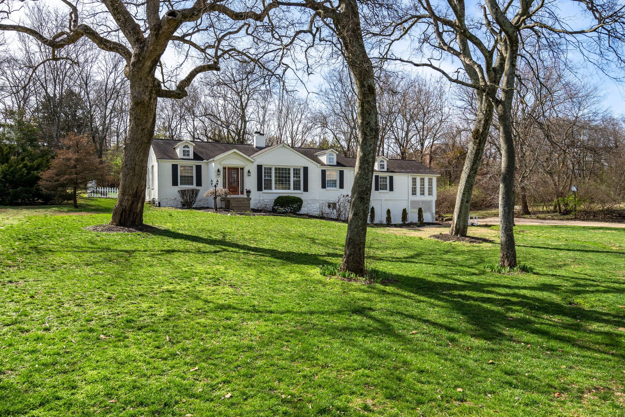 745 Elysian Fields Road Nashville, TN 37204 - Photo 3 of 60 a front view of a house with a yard and trees