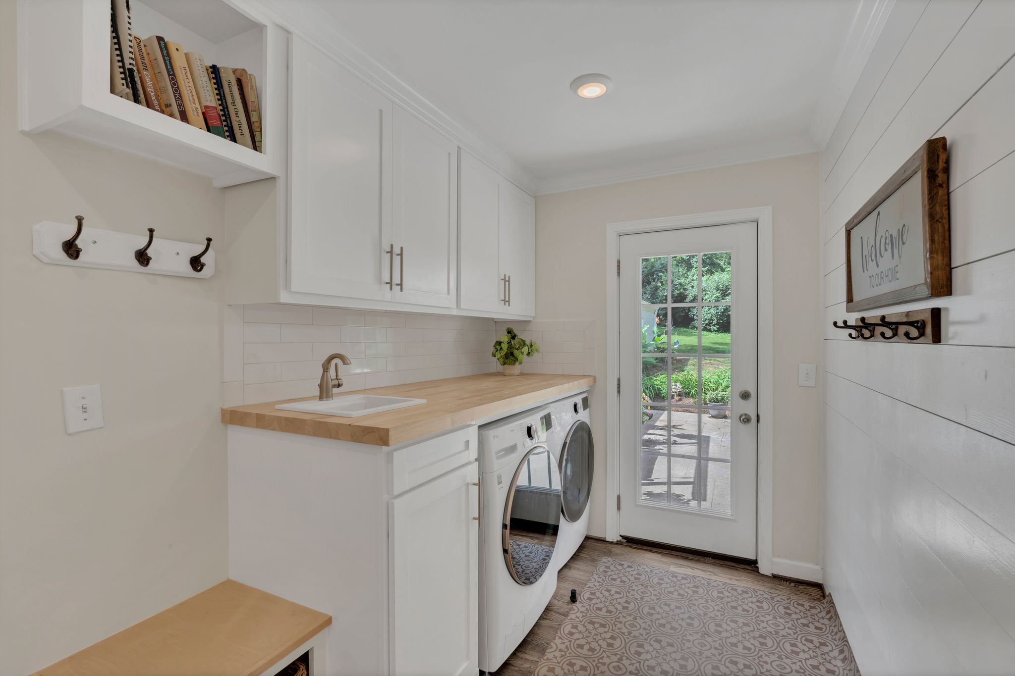 745 Elysian Fields Road Nashville, TN 37204 - Photo 39 of 60 a utility room with cabinets washer and dryer
