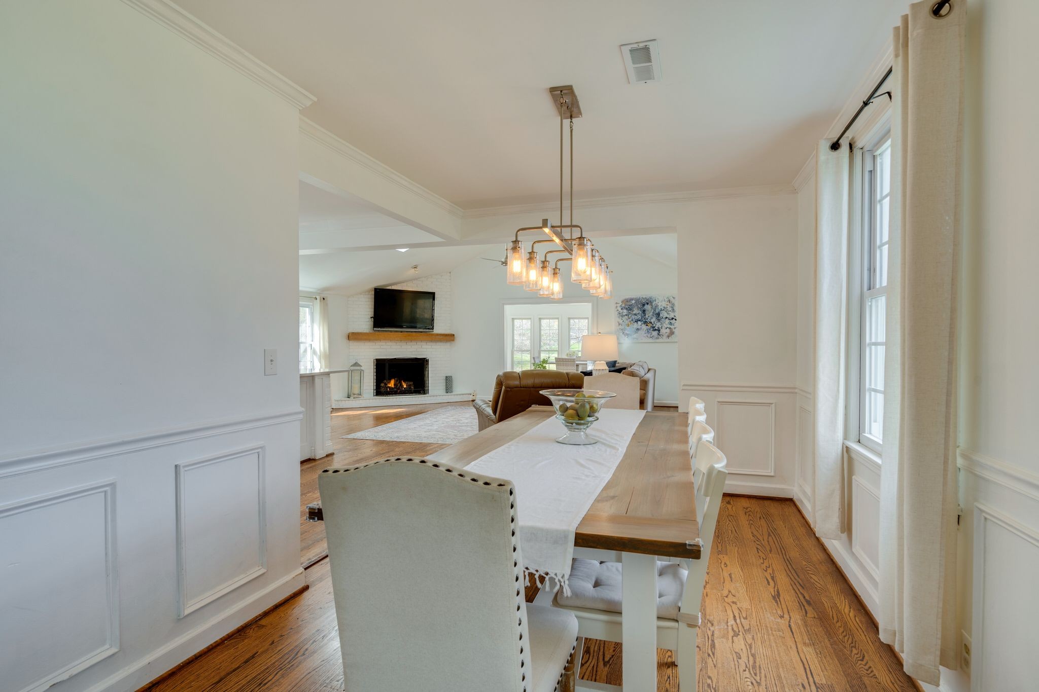 745 Elysian Fields Road Nashville, TN 37204 - Photo 10 of 60 a view of a dining room and livingroom with furniture wooden floor a chandelier