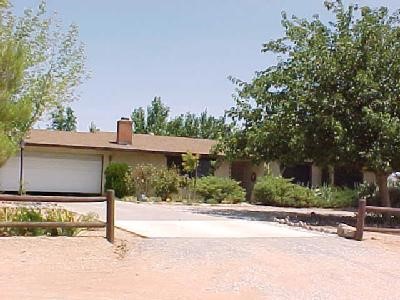 16461 Tenaya Road Apple Valley, CA 92307 - Photo 1 of 1 a view of a street with a building in the background