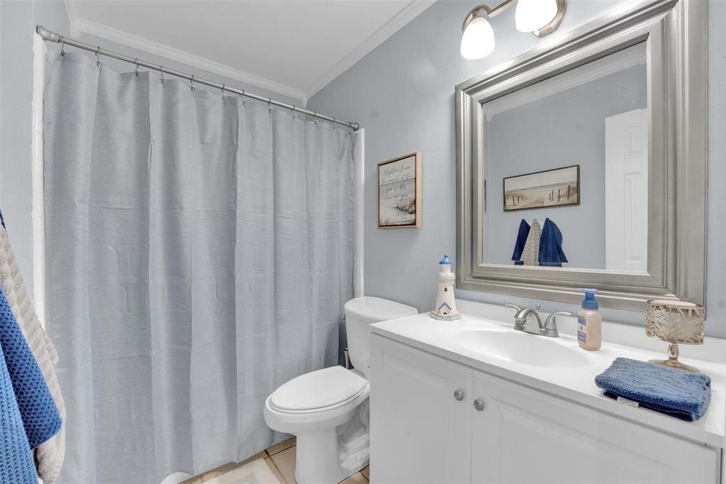 1008 Kay Lynn Street Mansfield, TX 76063 - Photo 11 of 21 a bathroom with a sink a toilet and a mirror