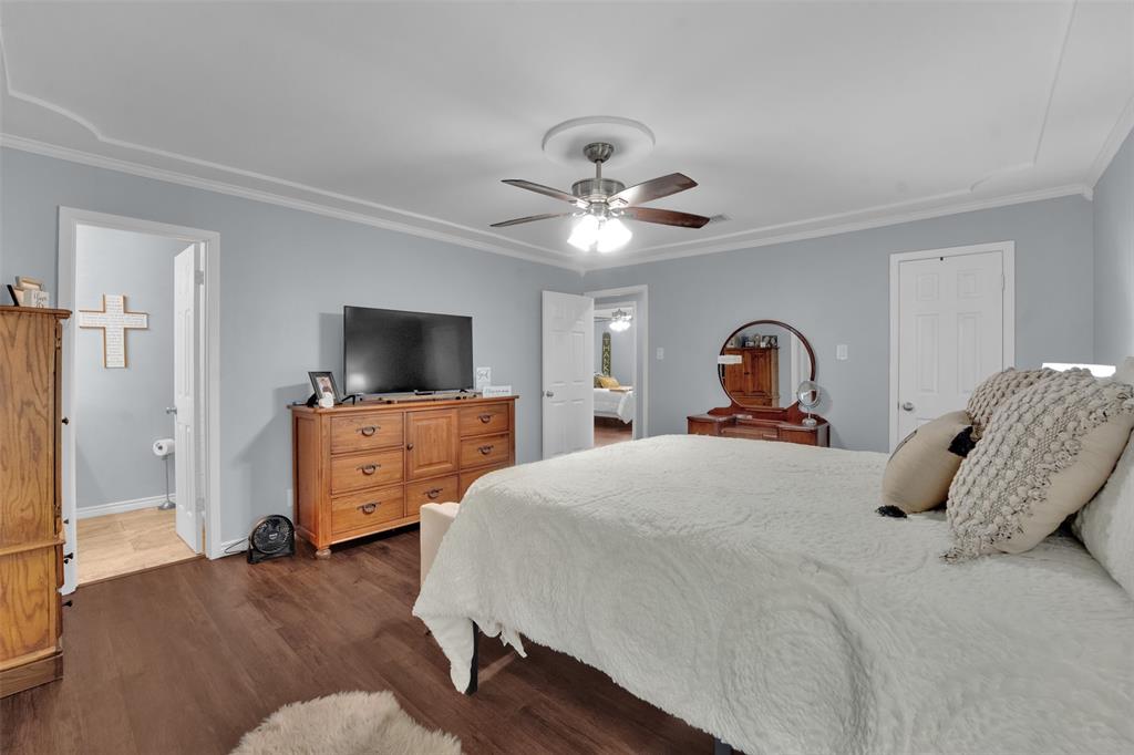 1008 Kay Lynn Street Mansfield, TX 76063 - Photo 15 of 21 a bedroom with a bed and a flat screen tv