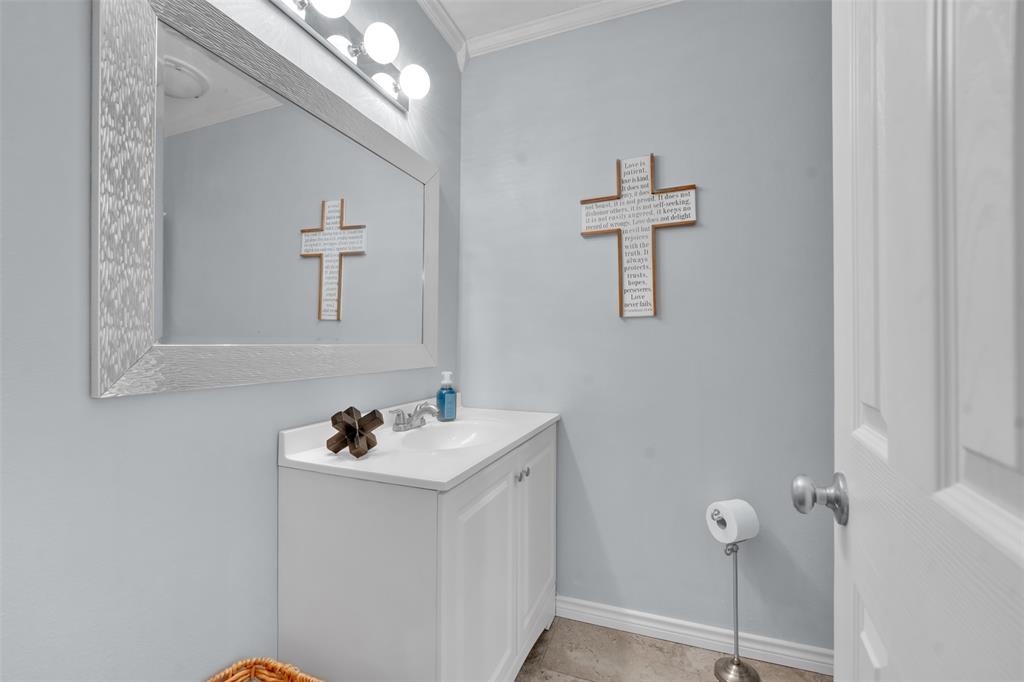 1008 Kay Lynn Street Mansfield, TX 76063 - Photo 16 of 21 a bathroom with a sink a mirror and vanity