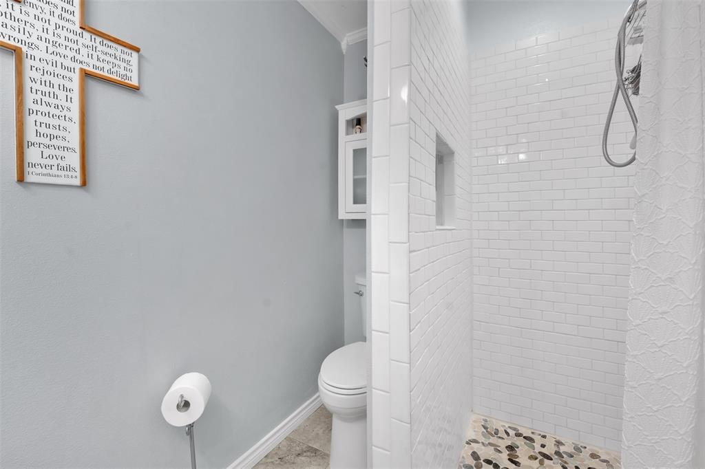 1008 Kay Lynn Street Mansfield, TX 76063 - Photo 17 of 21 a bathroom with a toilet and a shower