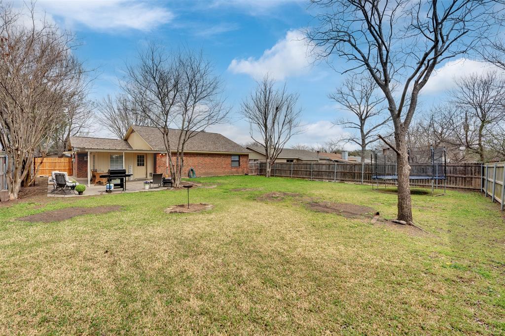 1008 Kay Lynn Street Mansfield, TX 76063 - Photo 21 of 21 a view of yard with swimming pool and trees