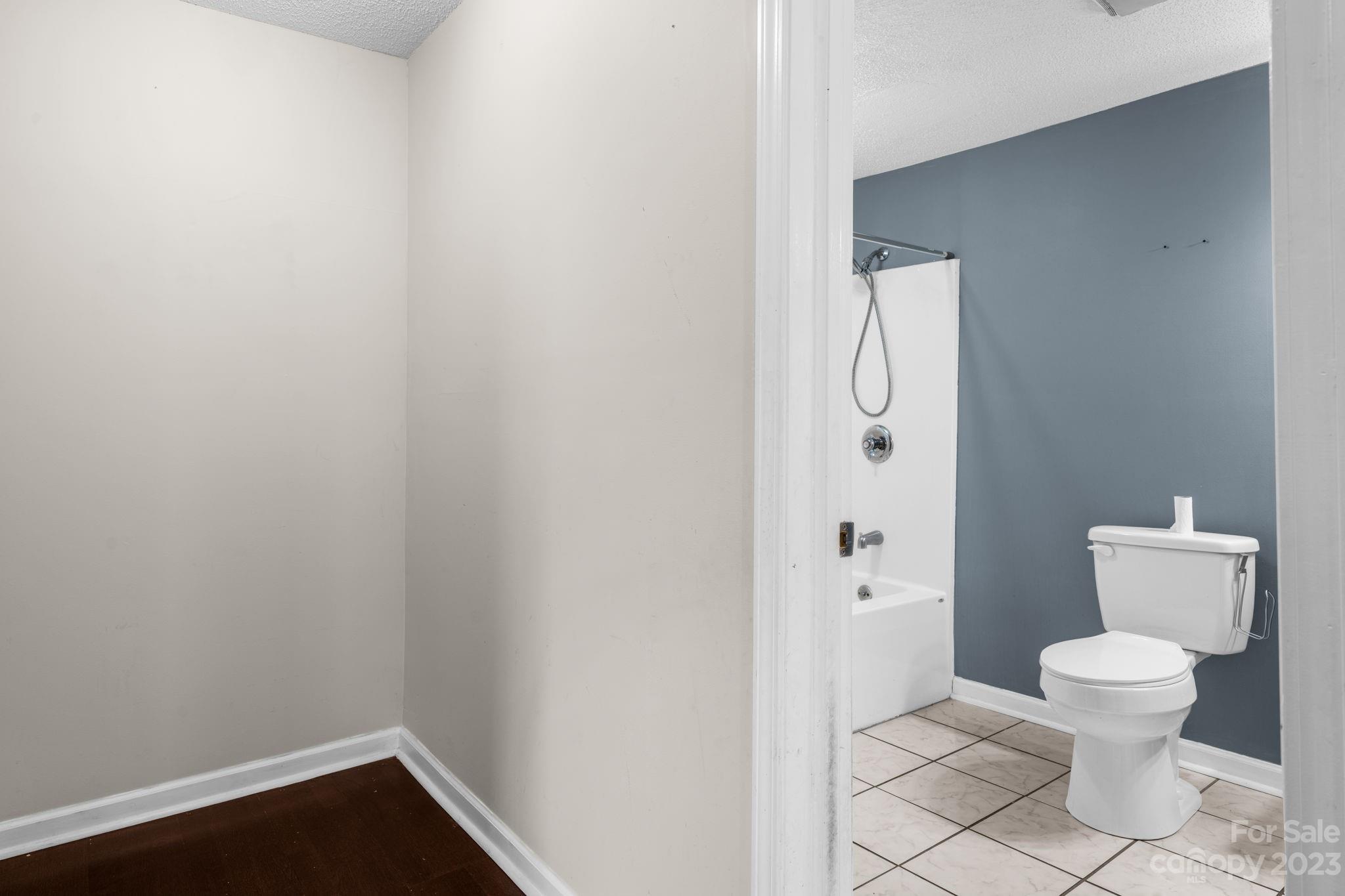 515 Salem Road Morganton, NC 28655 - Photo 11 of 33 a white toilet sitting next to a bathroom sink