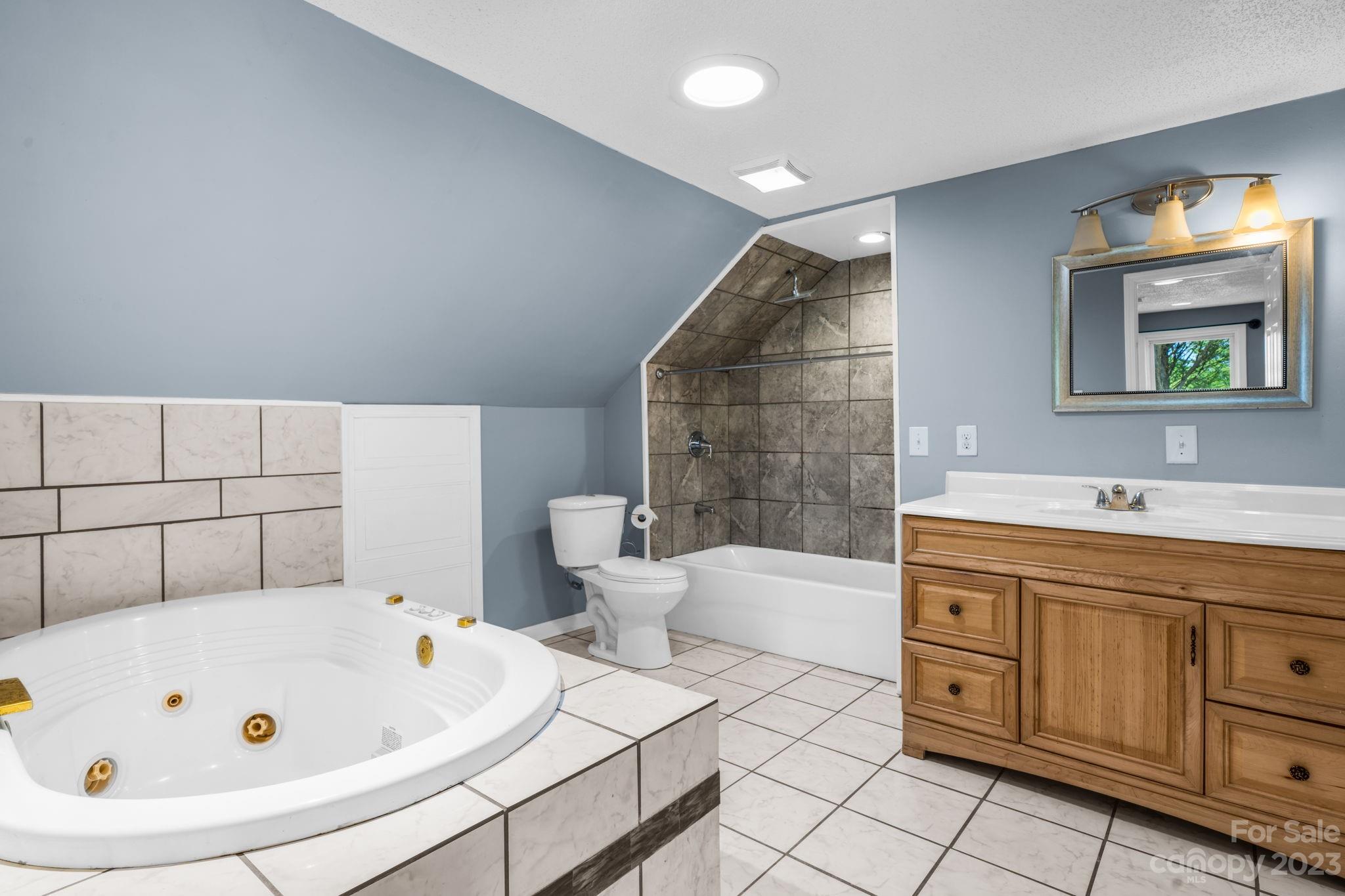 515 Salem Road Morganton, NC 28655 - Photo 23 of 33 a bathroom with a bathtub sink mirror and toilet