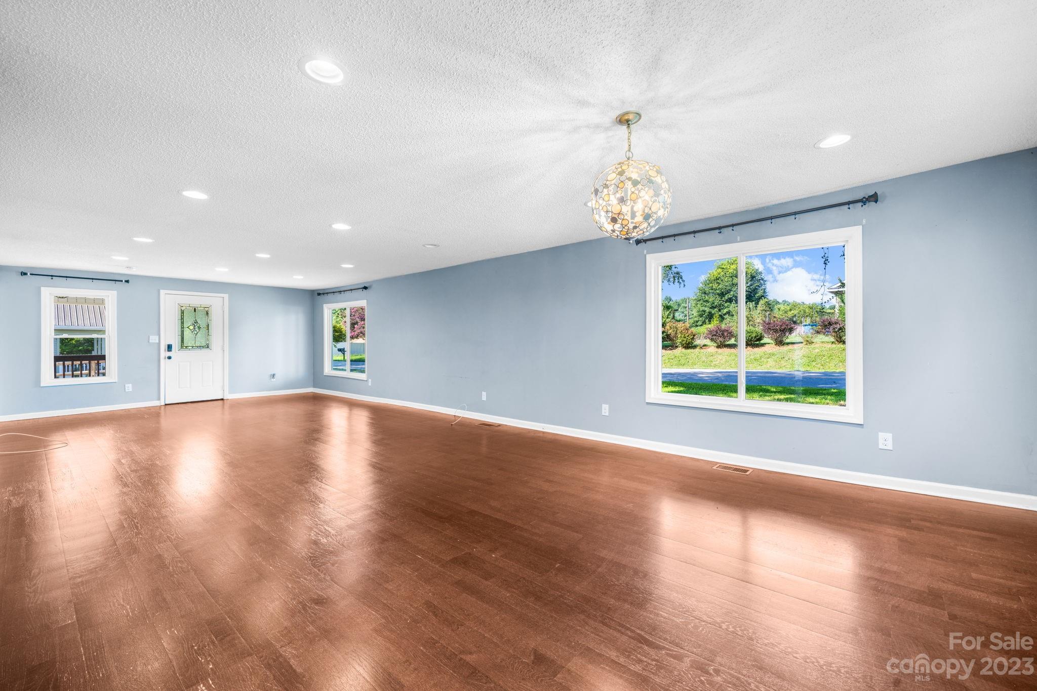 515 Salem Road Morganton, NC 28655 - Photo 3 of 33 a view of room with window and wooden floor