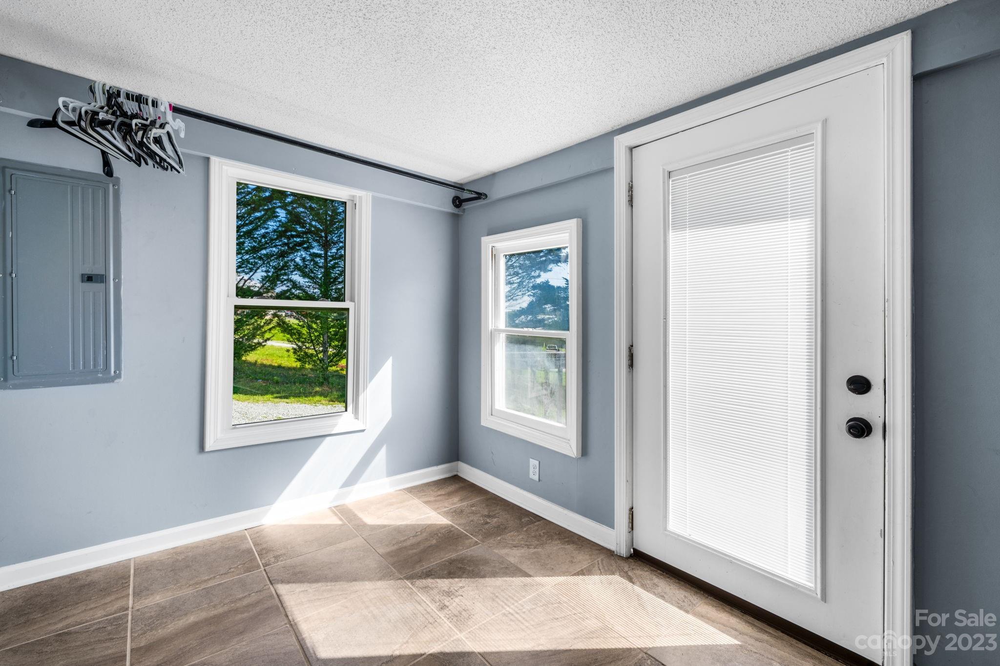 515 Salem Road Morganton, NC 28655 - Photo 9 of 33 a view of an empty room with window and front door