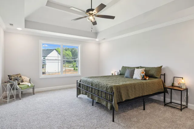 an empty room with a ceiling fan and window