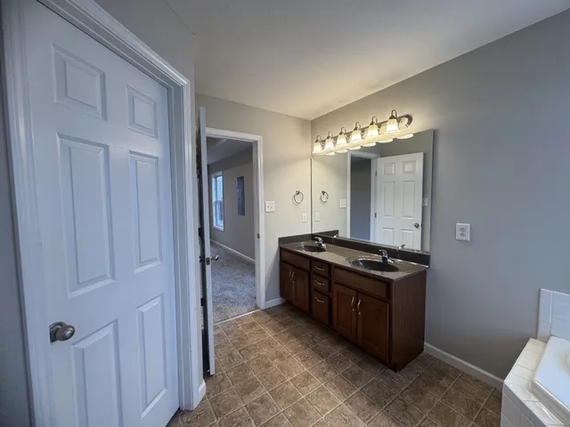 a kitchen with stainless steel appliances granite countertop a stove and a refrigerator