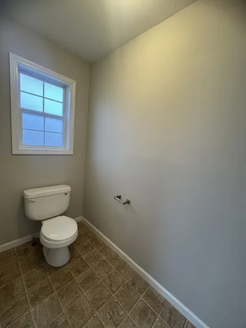 a bathroom with a toilet