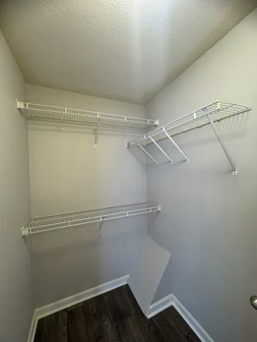 a view of a room with racks on the wall
